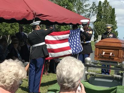 Marines folding flag for USMC Sgt James Joseph Hubert