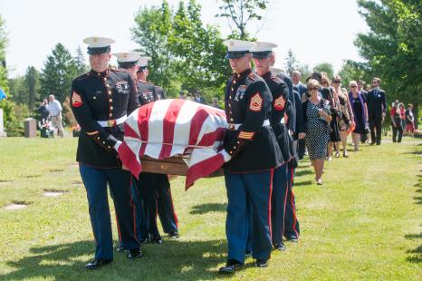 Marines carrying USMC Sgt James Joseph Hubert to gravesite