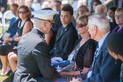 Presenting flag to sister of USMC Sgt James Joseph Hubert, Mary K (Hubert) Hagen